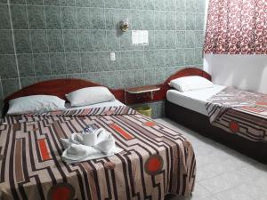 Postel nebo postele na pokoji v ubytování Hotel Naj Kin