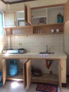 Kuchyň nebo kuchyňský kout v ubytování Sunrise Apartelle