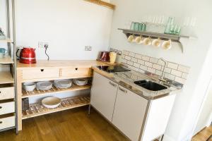 a small kitchen with a sink and a counter at Shellbraes Studio in Ryal