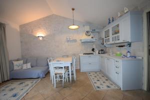 Η κουζίνα ή μικρή κουζίνα στο Villa Borgo - Chia