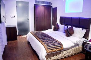 Postel nebo postele na pokoji v ubytování Hotel Sun International