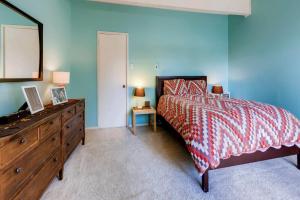 a bedroom with a bed and a dresser and a mirror at One-Bedroom Sundowner Condo T4 in Breckenridge