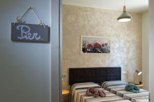 Postel nebo postele na pokoji v ubytování La casa di Primo
