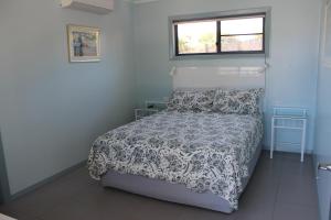 Llit o llits en una habitació de Gecko Guest House