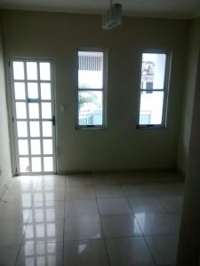 an empty room with two windows and a tiled floor at Apartamento Triplex in Rio de Janeiro