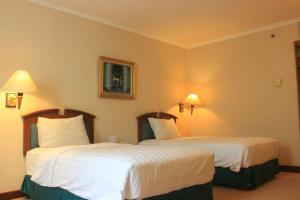 Letto o letti in una camera di Grand Arkenso Park View
