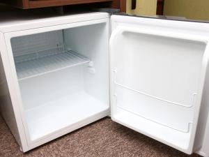 an empty white refrigerator with its door open at Hotel Wing International Select Ueno Okachimachi in Tokyo