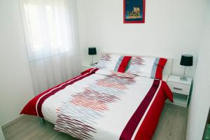 Postel nebo postele na pokoji v ubytování Apartments 1234