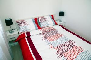 Postel nebo postele na pokoji v ubytování Apartments 1234