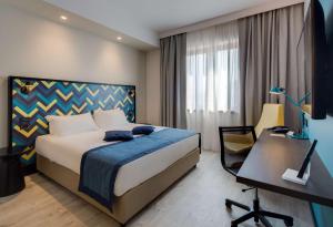 Postel nebo postele na pokoji v ubytování Best Western Hotel Cristallo