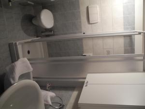 a bathroom with a toilet and a sink and a bath tub at Agriturismo Cornolere in Castelcucco