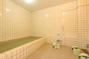 a bathroom with two sinks and a bath tub at Lodge Sano in Daisen +27 photos