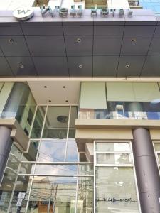 a large building with a lot of windows at The Well Hotel in Cebu City