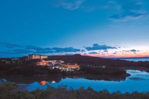 a house on a hill next to a river at Miyako Resort Okushima Aqua Forest (Hotel Kintetsu Aqua Villa Ise Shima) in Shima