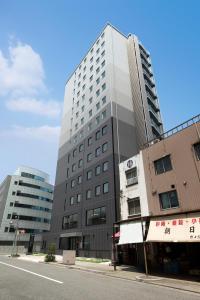 a tall building on the side of a street at Via Inn Nagoya Station Tsubaki-cho in Nagoya