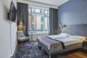 Postel nebo postele na pokoji v ubytování K7 Hotel Oslo