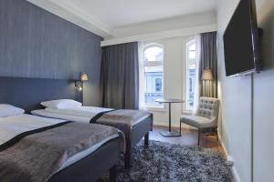 Postel nebo postele na pokoji v ubytování K7 Hotel Oslo
