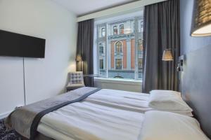 Postel nebo postele na pokoji v ubytování K7 Hotel Oslo