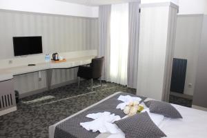 Ένα ή περισσότερα κρεβάτια σε δωμάτιο στο Anka Premium Hotel