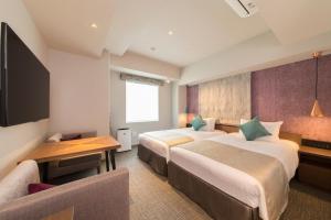 Voodi või voodid majutusasutuse Tokyu Stay Takanawa Shinagawa Area toas