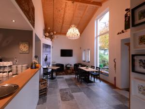 a kitchen and dining room with a table and chairs at Am Paradies in Müllheim