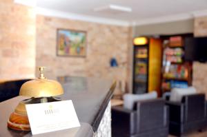 a counter in a store with a sign on it at Elite Hotel City Center Saray Bed and Breakfast in Saray