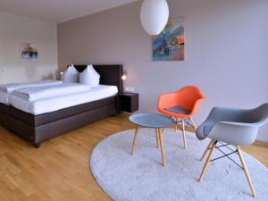 A bed or beds in a room at Am Paradies