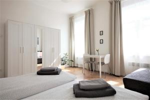 Postel nebo postele na pokoji v ubytování Angel City Aparthotel