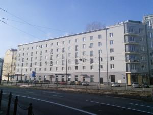 a large white building on the side of a street at Studio Narutowicza in Warsaw