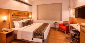 Postel nebo postele na pokoji v ubytování Lemon Tree Hotel Lucknow
