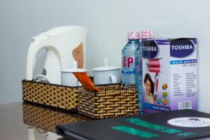 a basket with food and a bottle of water on a table at Paradise Hotel in Hoi An