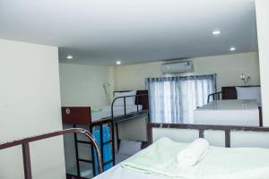 a room with several bunk beds in a room at Paradise Hotel in Hoi An