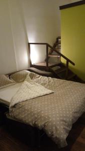 a bedroom with two bunk beds and a staircase at Laura Studio - Central in Oradea