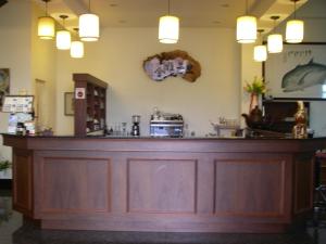 a bar in a restaurant with a wooden counter at Chong Er Ya She Homestay in Jiji