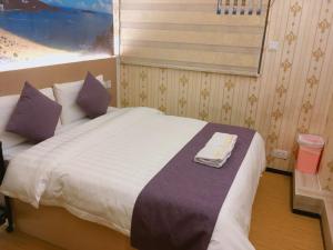 Whole Sunshine International Guest House 객실 침대