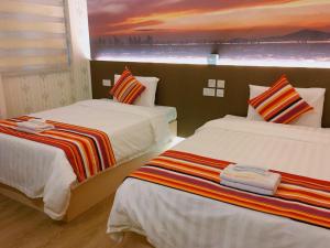 Whole Sunshine International Guest House 객실 침대