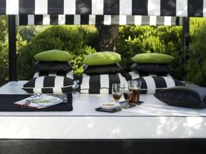 a table with pillows and drinks on top at Quinta da Lua in Tavira