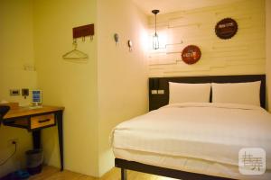 Postel nebo postele na pokoji v ubytování Re-Change Hotel Taipei