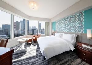 a bedroom with a large bed and a large window at The Prince Park Tower Tokyo - Preferred Hotels & Resorts, LVX Collection in Tokyo