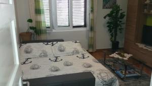 Postel nebo postele na pokoji v ubytování APARTMENT "Patricia"