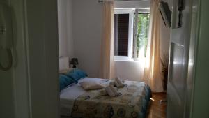 Postel nebo postele na pokoji v ubytování APARTMENT "Patricia"