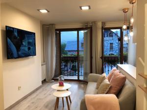 A seating area at Villa de Plan Apartments&Suites