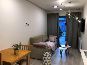A seating area at Villa de Plan Apartments&Suites