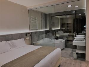A bed or beds in a room at Villa de Plan Apartments&Suites