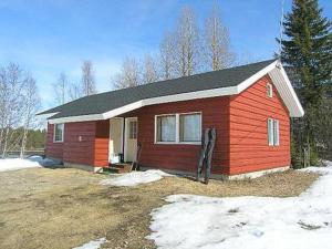 a small red house with snow in front of it at Holiday Home Riitula by Interhome in Jokijärvi