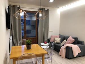 A seating area at Villa de Plan Apartments&Suites