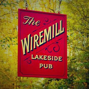 a red sign that reads the warmthlikettle pub at The Wiremill Sleep Boutique in Felbridge