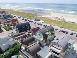 an aerial view of a beach with buildings and the ocean at Apartment De Zeeparel by Interhome in Egmond aan Zee