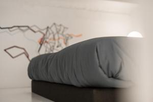 A bed or beds in a room at Almudena Modern & luxury space near Plaza Mayor