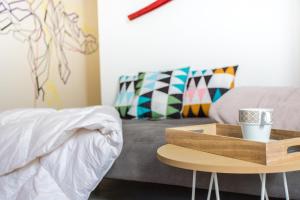 A bed or beds in a room at Almudena Modern & luxury space near Plaza Mayor